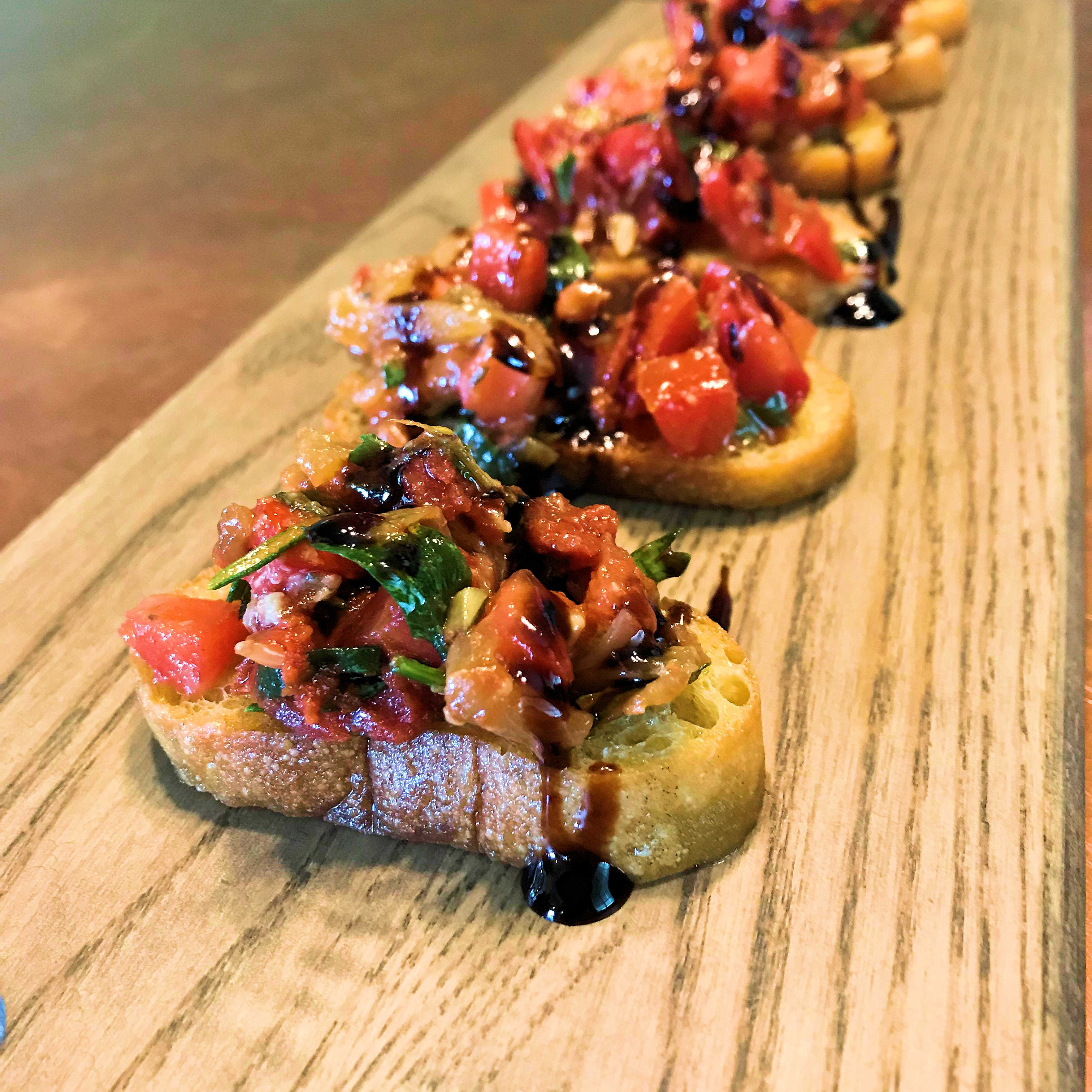 Classic Tomato Bruschetta Crostini with Caramelized Onions